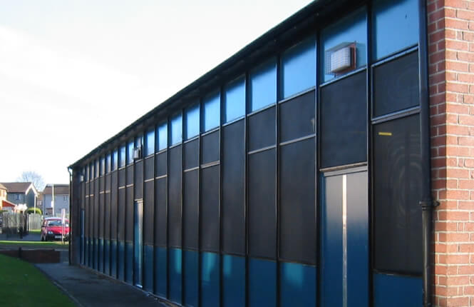 RSG2200 window security shields on industrial unit in Hackney.